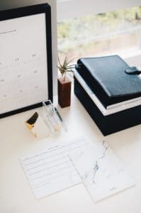 A desk with some business stuff on it.