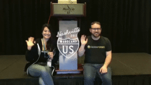 Josh and Christie from Caldera waving at WordCamp US