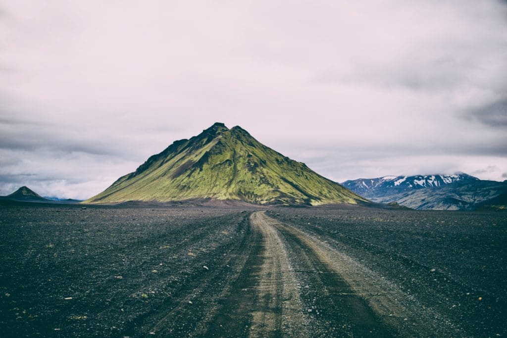 an image of a volcano at the end of a road